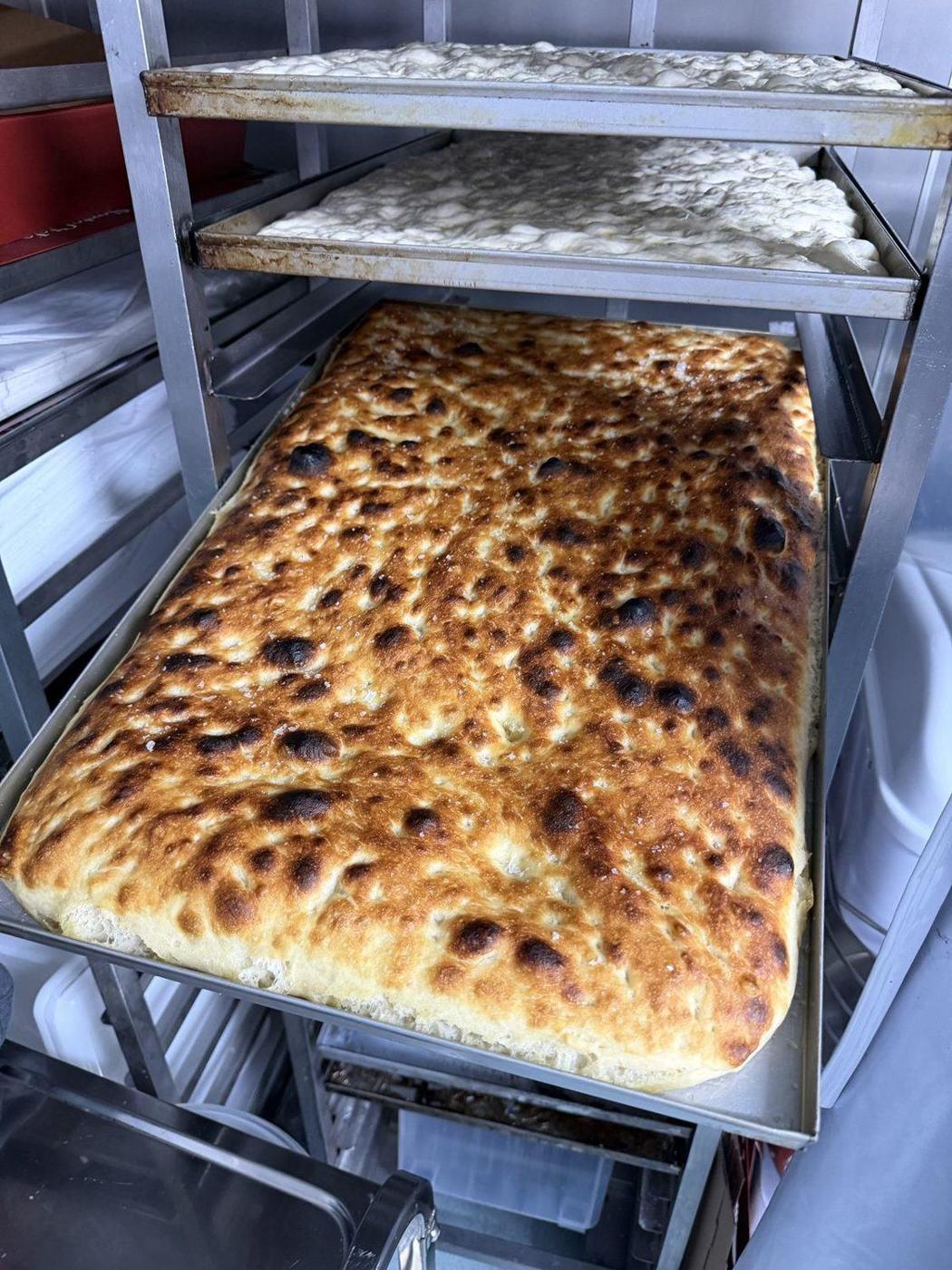 A tray of freshly baked golden schiacciata